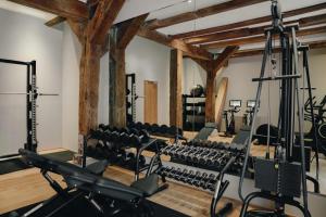 an empty gym with rows of exercise equipment at Admiral Hotel Copenhagen in Copenhagen