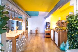 a dining room with a wooden table and chairs at Blanca by Uephotels in Can Picafort