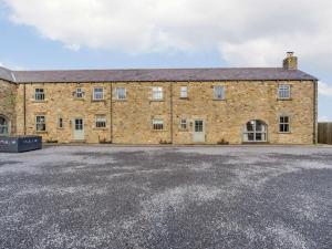 an old brick building with a parking lot at 3 Bed in Consett oc-29403 in Lanchester