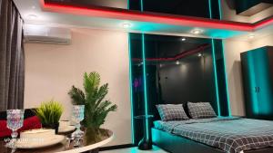 a room with a bed and a table with a table sidx sidx at Астана 34 in Ustʼ-Kamenogorsk