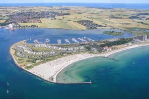 an aerial view of a beach with a resort at Strandliebe-I-mit-Balkon in Burgtiefe auf Fehmarn  +30 photos