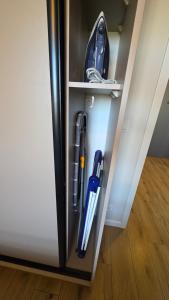 a refrigerator door is open with some items inside at Wyspa9 - Gdańsk Wyspa Sobieszewska in Gdańsk