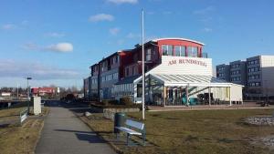 a building with a bench in front of it at Strandliebe-I-mit-Balkon in Burgtiefe auf Fehmarn 