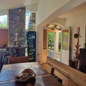 a living room with a table and a dining room at Villa Rossi in Krk