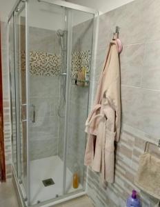 a shower in a bathroom with a glass shower stall at Casa sulla spiaggia in Genoa