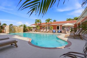 a swimming pool in the backyard of a house at Blind Pass Resort Motel in St. Pete Beach +113 photos