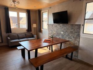 a living room with a table and a couch at Hilda Apartments Rust in Rust +16 photos