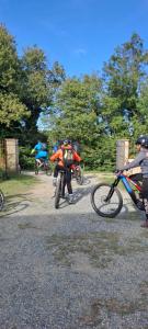 a group of people riding bikes on a gravel road at BeB La Bergera in Cessole