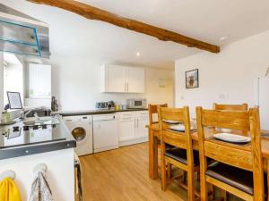 a kitchen and dining room with a table and chairs at 2 Bed in Pershore oc-83007 in Eckington