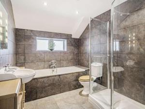 a bathroom with a shower toilet and a sink at 4 Bed in Skipton oc-89095 in Starbotton +29 photos