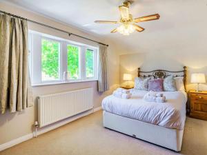 a bedroom with a bed with teddy bears on it at 4 Bed in Skipton oc-89095 in Starbotton
