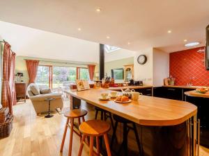 a kitchen with a large wooden island in a room at 3 Bed in Duns oc-89133 in Swinton