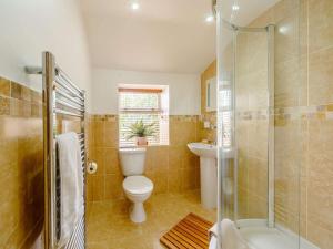 a bathroom with a toilet and a shower and a sink at 3 Bed in Duns oc-89133 in Swinton +14 photos