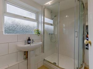 a bathroom with a sink and a shower at 3 Bed in Pershore oc-92975 in Eckington