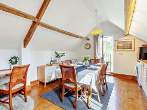 a kitchen and dining room with a table and chairs at 2 Bed in Malmesbury oc-91453 in Malmesbury