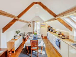 a kitchen and dining room with a table and chairs at 2 Bed in Malmesbury oc-91453 in Malmesbury
