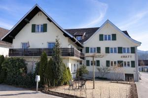 a white house with a black roof at S'Matt in Feldkirch