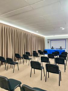 a room with chairs and a projection screen in a room with curtains at Hotel Subra Atrium in Herceg-Novi +113 photos