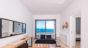 a living room with a view of the ocean at Borderline in Al Matlīn