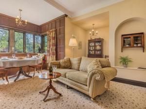 a living room with a couch and a table at 1 Bed in Penrith oc-sz350 in Orton