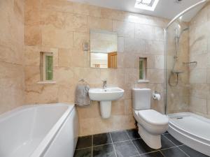 a bathroom with a sink and a toilet and a bath tub at 3 Bed in Hexham oc-96038 in Bardon Mill +16 photos