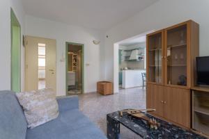 a living room with a couch and a tv at Villa Florence - Mediterranean GardenPool in Zaton