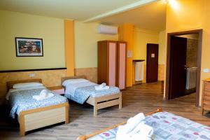 a hotel room with two beds in a room at Agriturismo la fornace in Como +104 photos