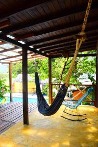 a hammock on the deck of a house at Dive and Green Capurgana in Capurganá
