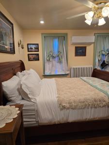 a bedroom with a bed and a window at Langdon Hill House in Gettysburg