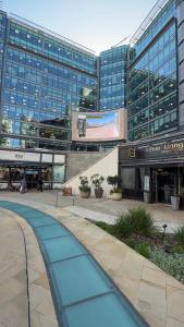 a large building with a walkway in front of it at VIP apartment paddington in London