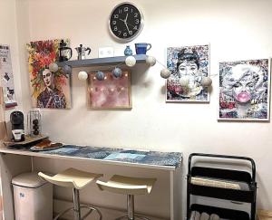 a room with a counter and some pictures on the wall at sunwave Tolo in Tolo
