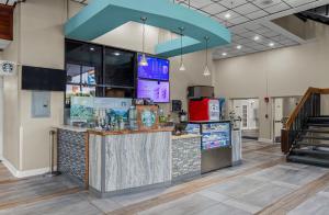 a restaurant with a bar in a building at Landmark Resort in Myrtle Beach