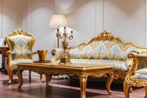 a living room with a couch and two chairs at SOL INVICTUS Boutique Hotel Durres Albania in Durrës