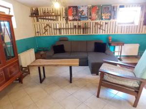 a living room with a couch and a table at carpedieme in Horní Brusnice