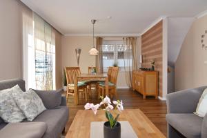 a living room with a couch and a table at Wodan, Whg 1 in Tinnum