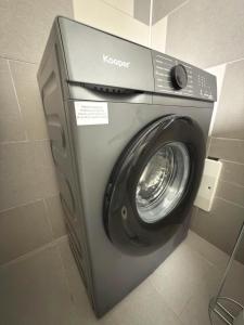 a washing machine in a bathroom with a washer at Residenza Frontemura in Montefalco