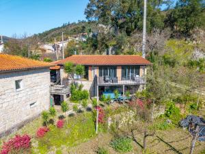 an aerial view of a house with a garden at Casa da Portazinha - by Proguest in Amares