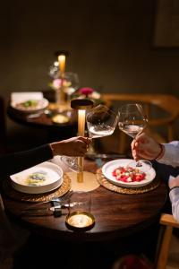 a group of people holding wine glasses on a table at Vico Milano in Milan +38 photos