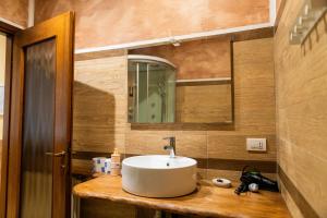 a bathroom with a sink and a mirror at Agriturismo la fornace in Como