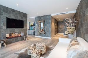 a living room with a couch and a fireplace at Van der Valk Hotel Utrecht in Utrecht