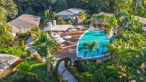 an aerial view of a resort with a swimming pool at Hotel Villa Mercedes Palenque in Palenque