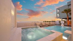 a swimming pool on a patio next to a building at The Pearl in Clearwater Beach