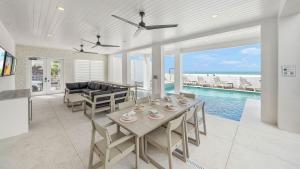 a living room with a table and a view of the ocean at The Pearl in Clearwater Beach