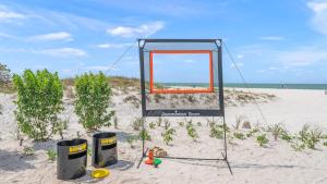 a mirror in the sand on a beach at The Pearl in Clearwater Beach