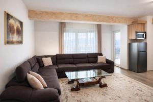 a living room with a couch and a coffee table at Dialb Apartments in Debar