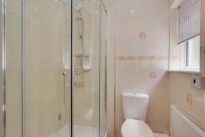 a bathroom with a toilet and a glass shower at 3 Bed in Sennen Cove oc-p00781 in Sennen +17 photos