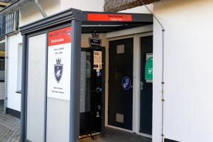 an entrance to a building with two vending machines at Hotel Giethoorn in Giethoorn
