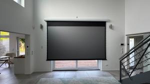 a large screen on the wall of a room at Exklusives Architektenhaus, Pool und Privateinfahrt in Mönchengladbach +21 photos