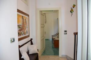 a hallway with a stairway leading to a room at Donna Alda Affittacamere Capitello dal 2012 in Villammare