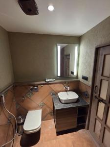 a bathroom with a sink and a mirror at ANVI Homestay in Bhopal